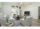 Bright living room features a sliding glass door and stylish decor at 5331 Villagebrook Dr, Wesley Chapel, FL 33544
