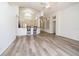 Bright living room with vaulted ceiling, fan, and wood floors offers lots of natural light at 5331 Villagebrook Dr, Wesley Chapel, FL 33544