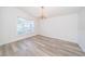 Empty Living Room features beautiful light from the large window at 5331 Villagebrook Dr, Wesley Chapel, FL 33544