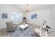 Office features a chandelier, ample light and a blue patterned area rug at 5331 Villagebrook Dr, Wesley Chapel, FL 33544
