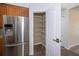 Pantry and refrigerator in the kitchen at 5331 Villagebrook Dr, Wesley Chapel, FL 33544
