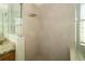 Walk-in shower with large tile and rain shower head at 5331 Villagebrook Dr, Wesley Chapel, FL 33544