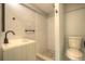 Updated bathroom features a shower and modern vanity at 610 N Woodlynne Ave, Tampa, FL 33609