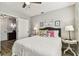 Bright bedroom with a cozy bed, accent pillows and art on the walls at 610 N Woodlynne Ave, Tampa, FL 33609