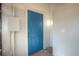 This home features a bright blue front door and neutral exterior at 610 N Woodlynne Ave, Tampa, FL 33609