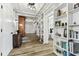Hallway featuring beautiful built-in shelving that leads to a bedroom and closet at 610 N Woodlynne Ave, Tampa, FL 33609