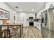 Modern kitchen with stainless steel appliances, white cabinets, and eat in nook at 610 N Woodlynne Ave, Tampa, FL 33609