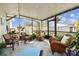 Comfortable screened patio with multiple chairs and a view of the backyard at 610 N Woodlynne Ave, Tampa, FL 33609