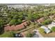 An aerial view of a residential community with lush greenery and well-maintained homes at 7501 Greystone Dr, Hudson, FL 34667