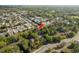 Aerial view showcasing the neighborhood and surrounding lush greenery at 7501 Greystone Dr, Hudson, FL 34667