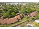 Aerial view of the property featuring a private patio and mature landscaping at 7501 Greystone Dr, Hudson, FL 34667