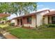 Quaint single-story home with well-manicured lawn and appealing exterior at 7501 Greystone Dr, Hudson, FL 34667