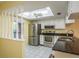 Bright kitchen area with granite counters and stainless steel appliances at 7501 Greystone Dr, Hudson, FL 34667