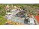 Aerial view showcasing community basketball, bocce ball, and tennis courts at 7501 Greystone Dr, Hudson, FL 34667
