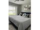 Comfortable bedroom featuring a large window and stylish decor at 9007 Pebble Creek Dr # 9007, Tampa, FL 33647