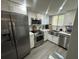 Modern kitchen featuring stainless steel appliances and a stylish farmhouse sink at 9007 Pebble Creek Dr # 9007, Tampa, FL 33647
