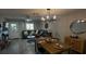 Open concept living room and dining area with modern decor and ample natural light at 9007 Pebble Creek Dr # 9007, Tampa, FL 33647