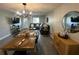 Spacious and open living area featuring comfortable seating, a dining table, and modern decor at 9007 Pebble Creek Dr # 9007, Tampa, FL 33647