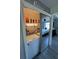 Convenient laundry closet with a washer, dryer, and mirrored doors, reflecting the adjacent bedroom at 9007 Pebble Creek Dr # 9007, Tampa, FL 33647