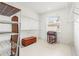 Large closet with extensive shelving and a window provides ample storage space at 1003 Berkshire Ln, Tarpon Springs, FL 34688