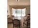 Bright living room with view of the pool, neutral walls, and access to screened patio at 1003 Berkshire Ln, Tarpon Springs, FL 34688
