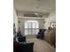 Cozy home office with a vaulted ceiling, ceiling fan, shuttered windows, and classic furnishings at 1003 Berkshire Ln, Tarpon Springs, FL 34688