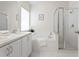 Bathroom with a double sink vanity, soaking tub, and a walk-in shower at 10339 Lightner Bridge Dr, Tampa, FL 33626