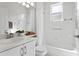 Clean bathroom featuring a vanity, tub with shower, and neutral finishes at 10339 Lightner Bridge Dr, Tampa, FL 33626