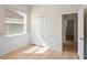 A well-lit bedroom featuring a closet and a view to the side door at 10339 Lightner Bridge Dr, Tampa, FL 33626