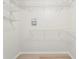 This walk-in closet features built-in wire shelving and laminate floors at 10339 Lightner Bridge Dr, Tampa, FL 33626
