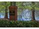 Wakebridge brick community entrance with landscaping and lake views at 10339 Lightner Bridge Dr, Tampa, FL 33626