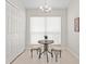 Cozy dining area featuring a stylish table, stools, and abundant natural light at 10339 Lightner Bridge Dr, Tampa, FL 33626