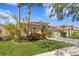 Well-maintained home with lush landscaping, mature trees, and a two-car garage at 10339 Lightner Bridge Dr, Tampa, FL 33626