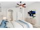 Comfortable bedroom featuring a ceiling fan, closet, and ensuite bathroom at 10339 Lightner Bridge Dr, Tampa, FL 33626