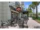 Outdoor seating area at the upscale cocktail lounge, Repeal 18, with palm trees and covered sidewalk at 10339 Lightner Bridge Dr, Tampa, FL 33626