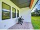 Outdoor brick patio area for grilling and enjoying the landscaped backyard at 111 Alafia Estates Ln, Plant City, FL 33567