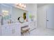 Bathroom featuring a vanity with double sinks, drawers, storage, makeup station, and a large mirror at 111 Alafia Estates Ln, Plant City, FL 33567