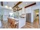 Bright kitchen island with bar stool seating and open floor plan at 111 Alafia Estates Ln, Plant City, FL 33567