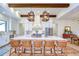 Bright kitchen features a large island with seating, pendant lighting, and stainless steel appliances at 111 Alafia Estates Ln, Plant City, FL 33567