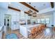 Kitchen island with bar stool seating and open floor plan to the dining area at 111 Alafia Estates Ln, Plant City, FL 33567