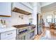 High-end kitchen with stainless steel appliances, designer hood, and stylish backsplash at 111 Alafia Estates Ln, Plant City, FL 33567