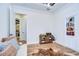 Bright room featuring wood floors, built-in shelving, and a plush sofa with decorative pillows at 111 Alafia Estates Ln, Plant City, FL 33567