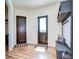 Well-organized mudroom with coat hooks, storage shelves, and stylish tile flooring at 111 Alafia Estates Ln, Plant City, FL 33567