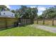 Wooden backyard fence with a rolling gate offering privacy and security at 1202 E Caracas St, Tampa, FL 33603