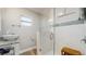Modern bathroom featuring a glass shower, stylish vanity, and neutral color palette at 1202 E Caracas St, Tampa, FL 33603