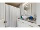 Modern bathroom with sleek vanity, vessel sink, and shower featuring a stylish shower curtain at 1202 E Caracas St, Tampa, FL 33603