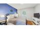 Stylish bedroom with a bold accent wall, comfortable bed, and modern decor providing a serene retreat at 1202 E Caracas St, Tampa, FL 33603