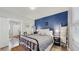 Stylish bedroom featuring a bold accent wall, comfortable bed, and modern decor providing a serene retreat at 1202 E Caracas St, Tampa, FL 33603