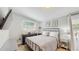 Cozy bedroom featuring a comfortable bed, neutral decor, and ample natural light from the window at 1202 E Caracas St, Tampa, FL 33603
