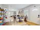 Open-concept dining area that is seamlessly connected to the living room and features hardwood floors throughout at 1202 E Caracas St, Tampa, FL 33603